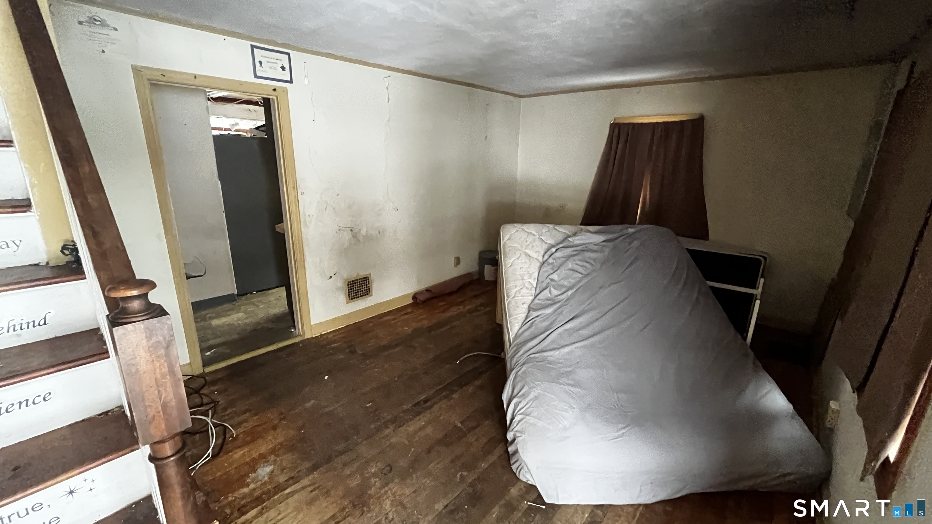 175 Moody Street Bristol, CT 06010 - Photo 12 of 22 a view of a hallway with wooden floor and staircase