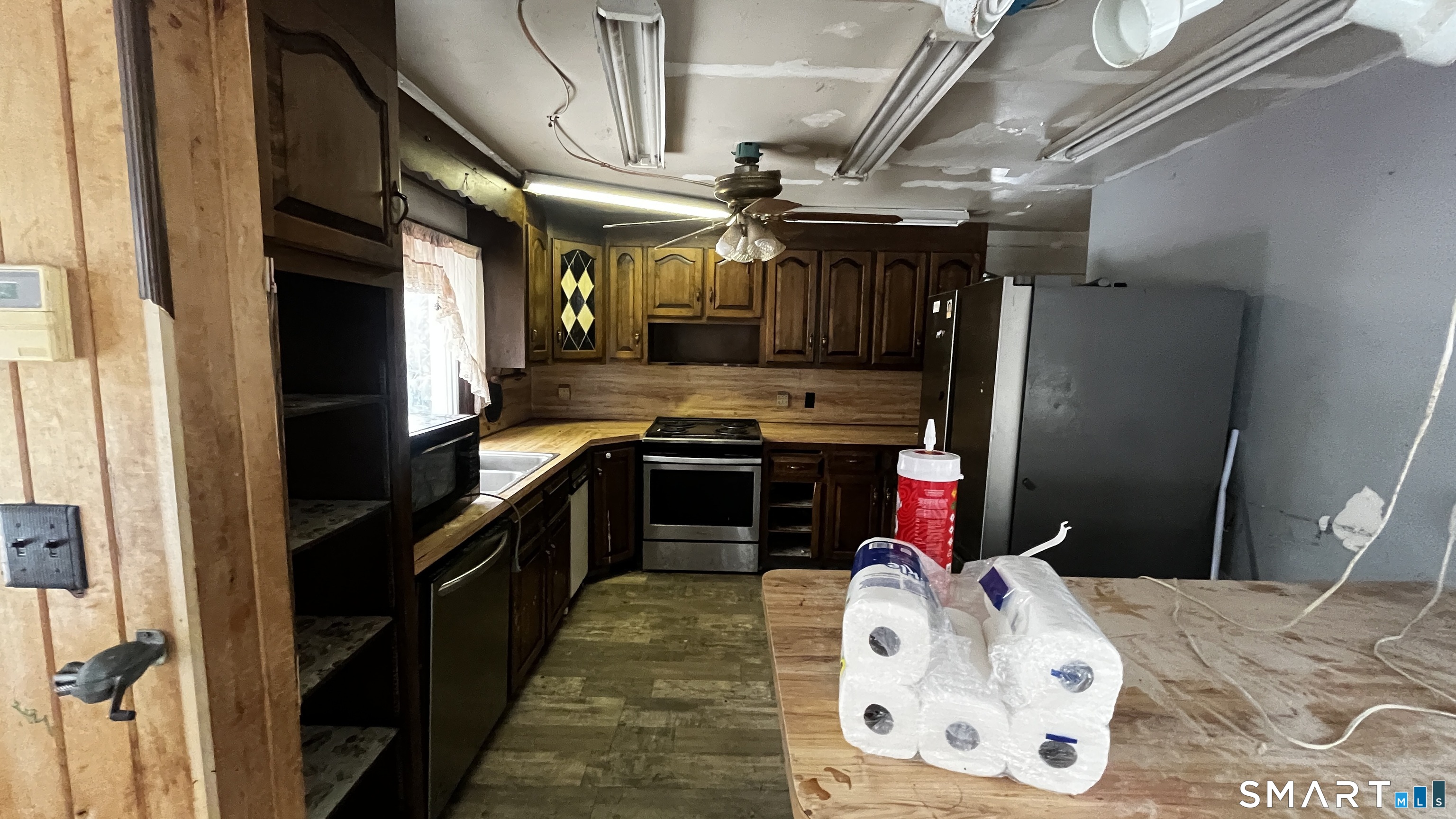 175 Moody Street Bristol, CT 06010 - Photo 5 of 22 a kitchen with stainless steel appliances granite countertop a stove a refrigerator and a dining table