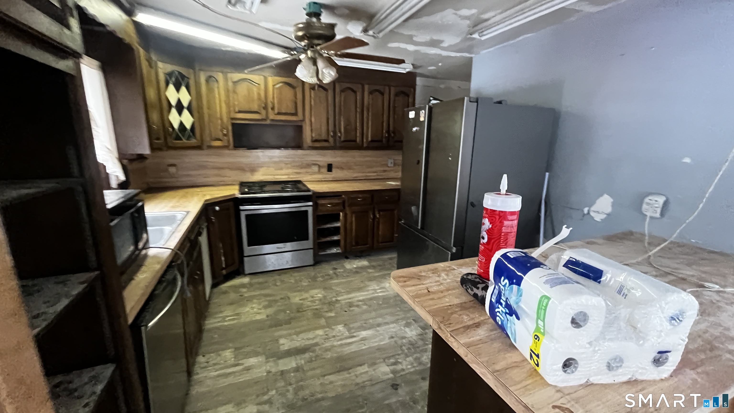 175 Moody Street Bristol, CT 06010 - Photo 6 of 22 a kitchen with stainless steel appliances granite countertop a sink a stove and a wooden cabinets