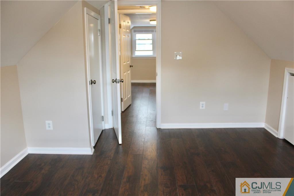 15 Roberts Road New Brunswick, NJ 08901 - Photo 21 of 25 a view of a hallway with wooden floor