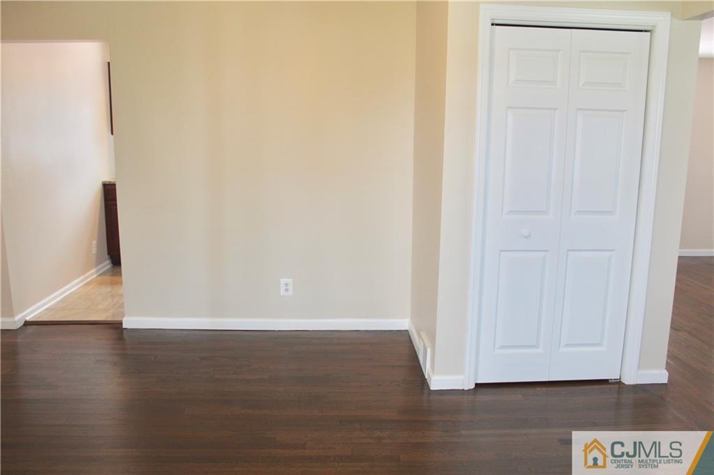 15 Roberts Road New Brunswick, NJ 08901 - Photo 5 of 25 a view of an empty room with wooden floor