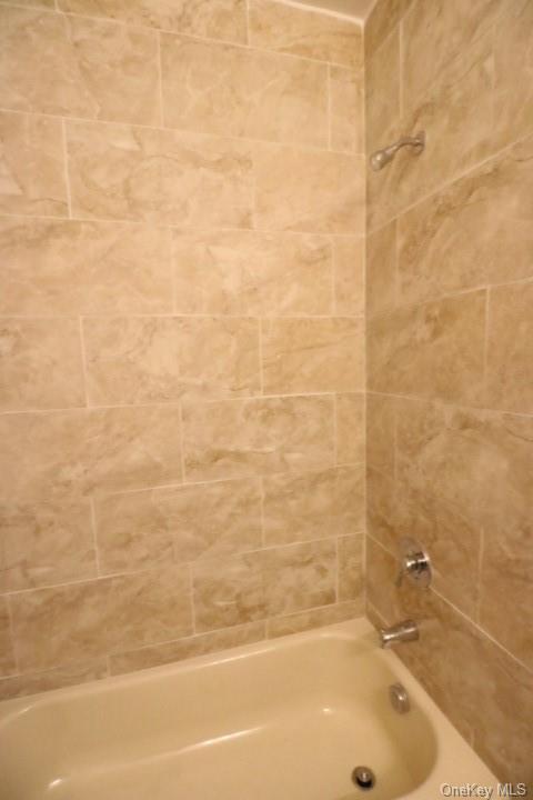 73 Main Street, Unit 2 Walden, NY 12586 - Photo 4 of 7 a bathroom with a bathtub