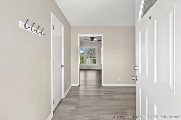 a view of an entryway with wooden floor