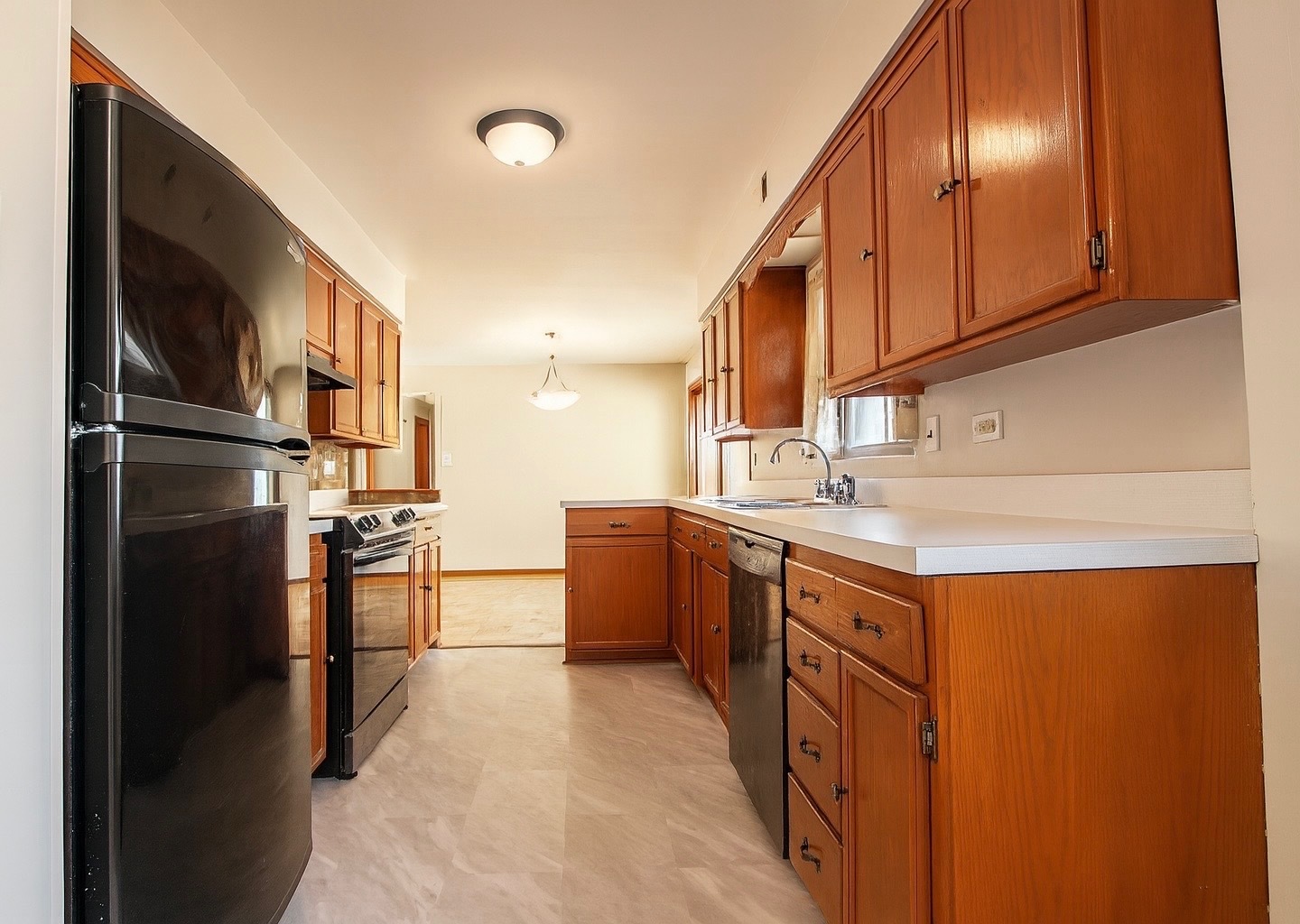 15547 Drexel Avenue Dolton, IL 60419 - Photo 11 of 18 a kitchen with stainless steel appliances granite countertop a refrigerator a stove and a sink