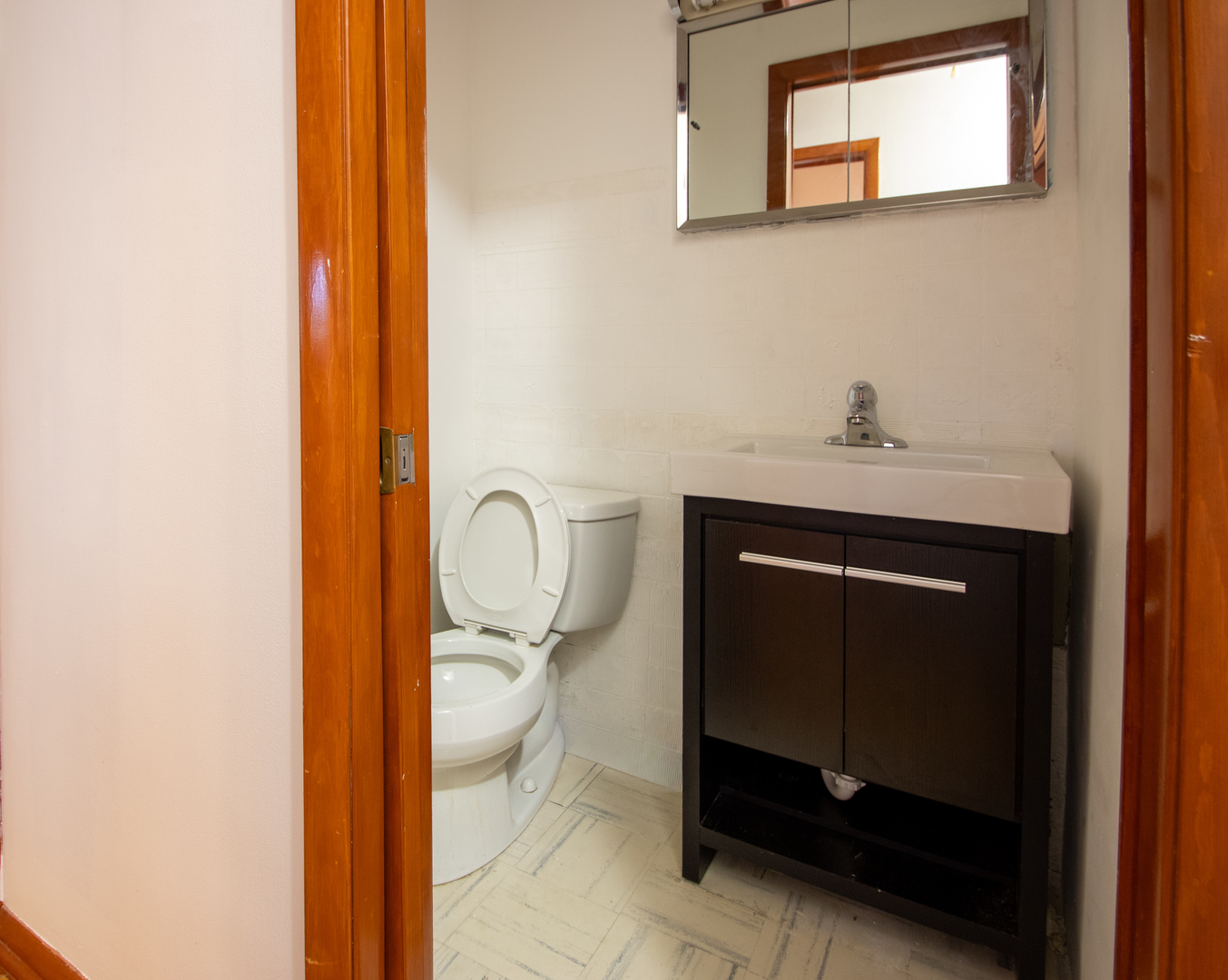 15547 Drexel Avenue Dolton, IL 60419 - Photo 14 of 18 a bathroom with a sink and a mirror