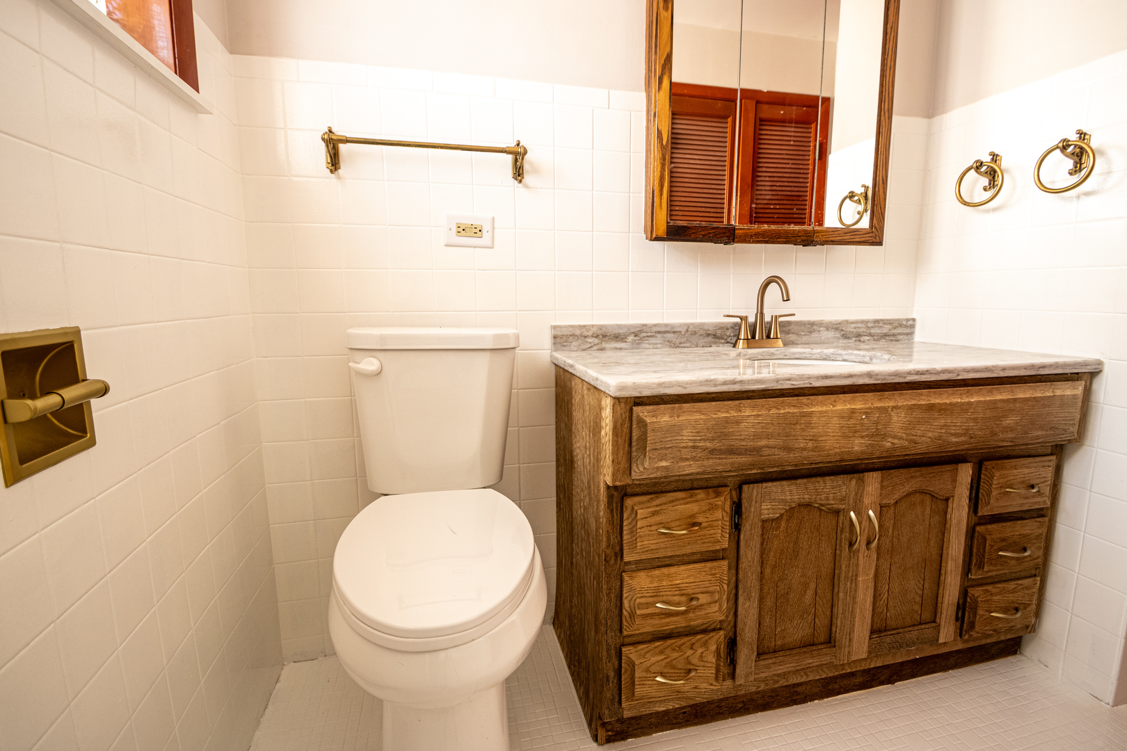 15547 Drexel Avenue Dolton, IL 60419 - Photo 15 of 18 a bathroom with a granite countertop toilet sink and mirror