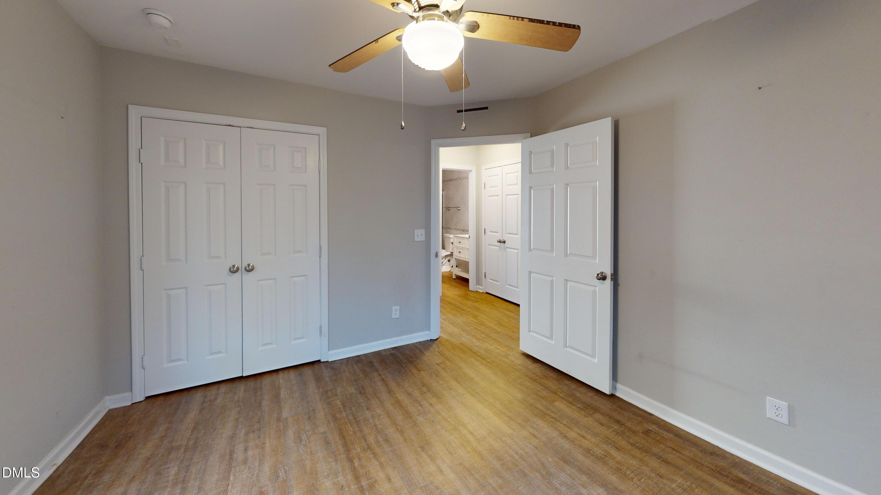 1312 South State Street, Unit A Raleigh, NC 27610 - Photo 5 of 12 a view of wooden floor and brick walls