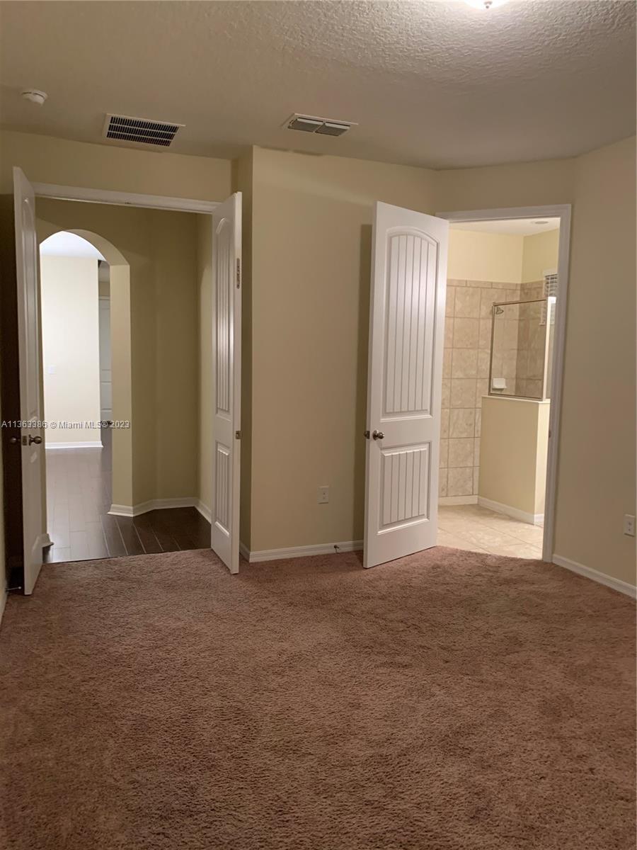 13832 Summerport Trail Loop Windermere, FL 34786 - Photo 11 of 39 an empty room with windows and closet