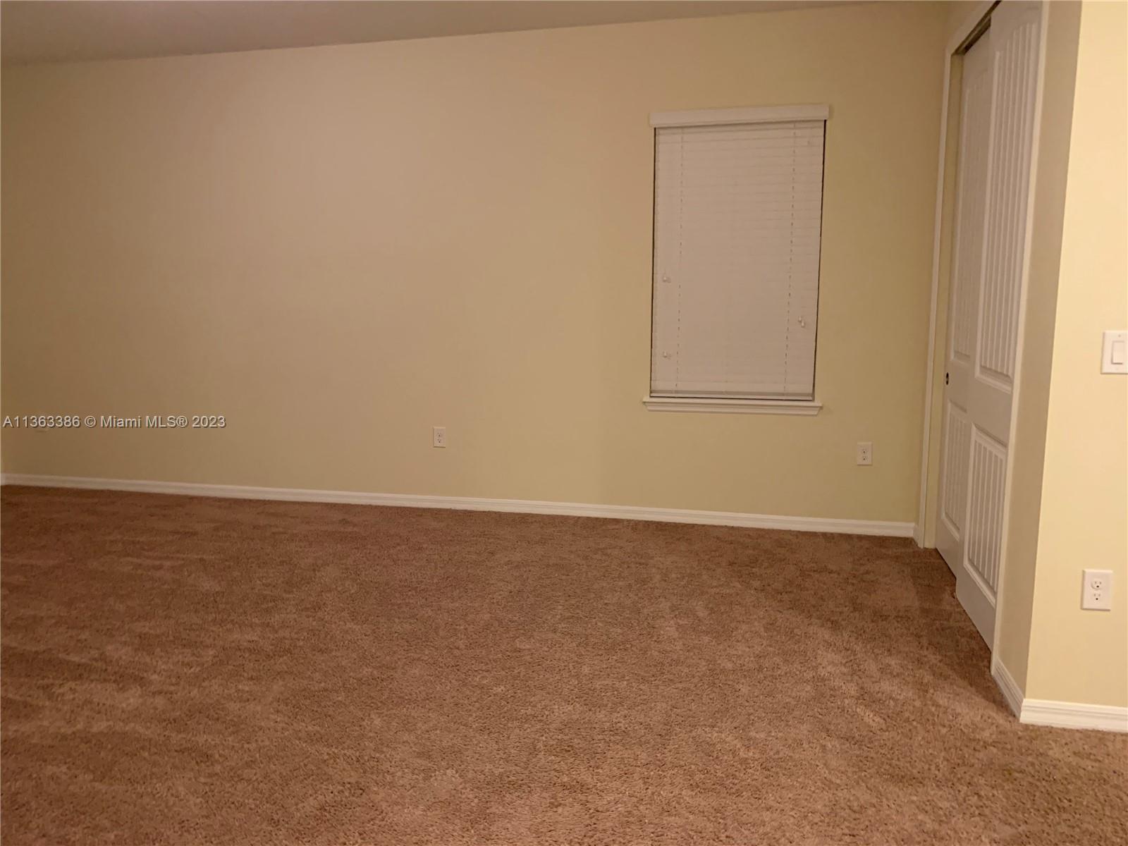 13832 Summerport Trail Loop Windermere, FL 34786 - Photo 18 of 39 a view of an empty room and window