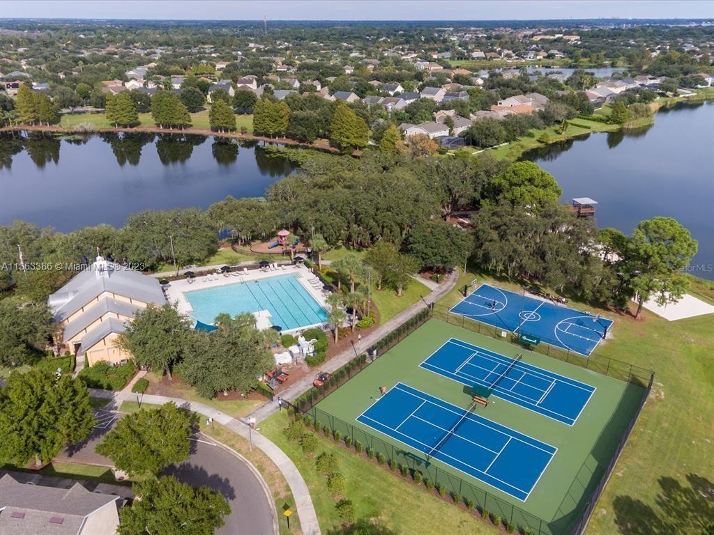 13832 Summerport Trail Loop Windermere, FL 34786 - Photo 30 of 39 an aerial view of residential houses with outdoor space and river view