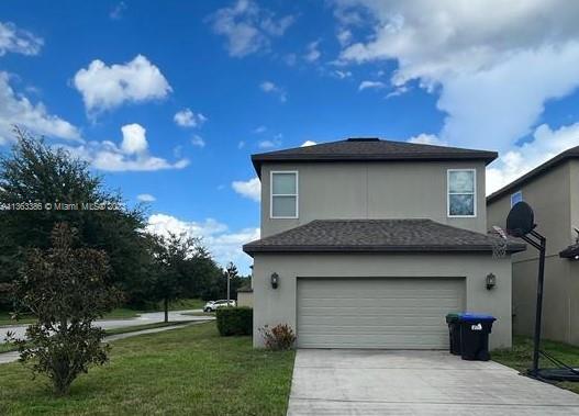 13832 Summerport Trail Loop Windermere, FL 34786 - Photo 3 of 39 a front view of a house with a garden
