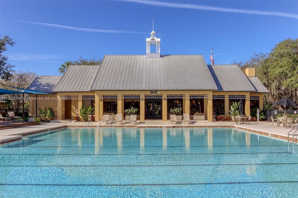 13832 Summerport Trail Loop Windermere, FL 34786 - Photo 34 of 39 a front view of a house with a yard