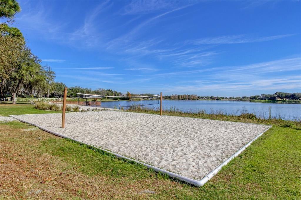 13832 Summerport Trail Loop Windermere, FL 34786 - Photo 36 of 39 a view of a lake with a beach