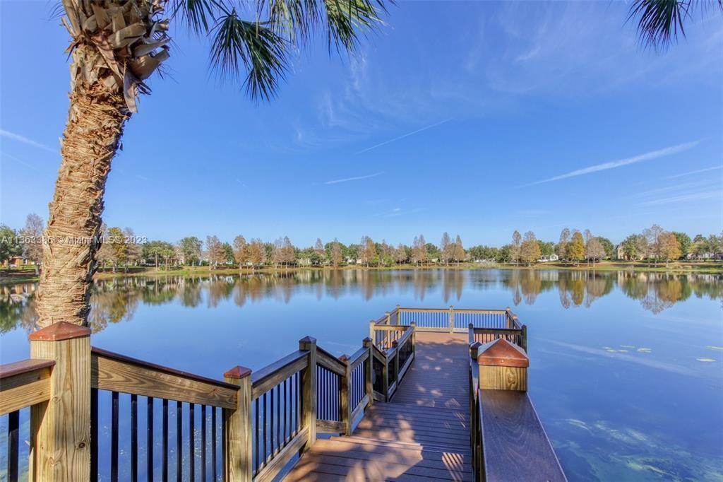 13832 Summerport Trail Loop Windermere, FL 34786 - Photo 37 of 39 a view of a lake with houses