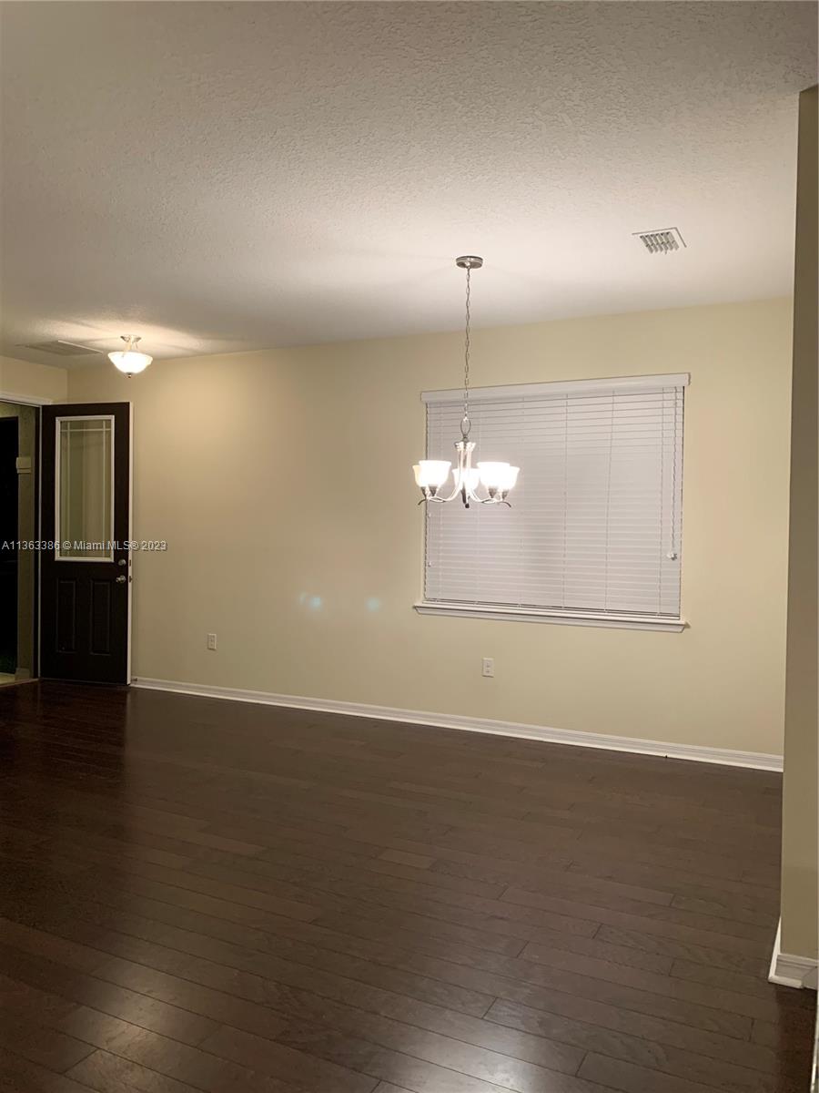 13832 Summerport Trail Loop Windermere, FL 34786 - Photo 6 of 39 an empty room with wooden floor