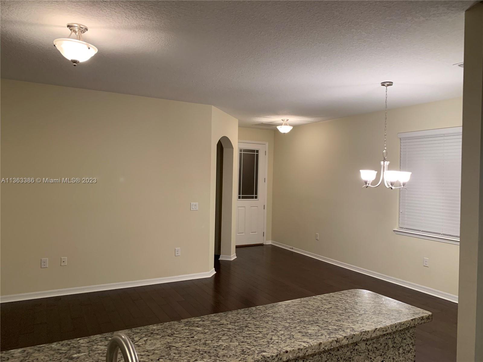 13832 Summerport Trail Loop Windermere, FL 34786 - Photo 7 of 39 a view of a livingroom with wooden floor