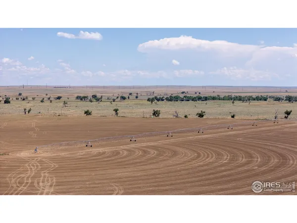 a view of a swimming pool and an outdoor seating