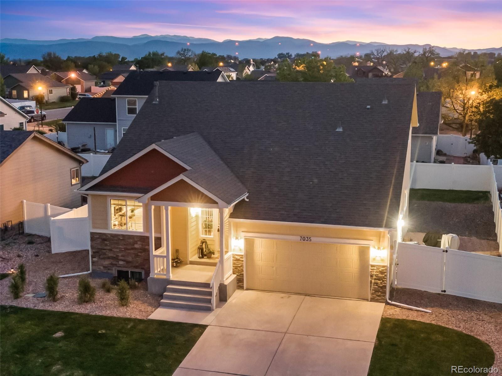 7035 McClellan Road Wellington, CO 80549 - Photo 8 of 43 an aerial view of a house with a yard swimming pool and mountain view in back