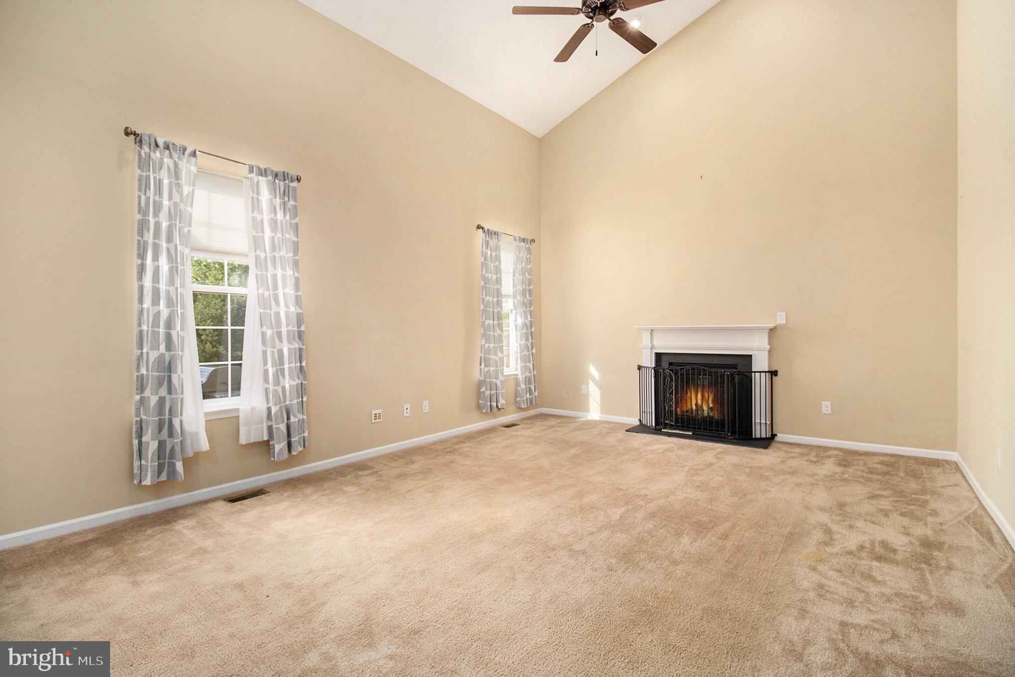 1226 Cabin Road Hatfield, PA 19440 - Photo 12 of 28 an empty room with fireplace and windows