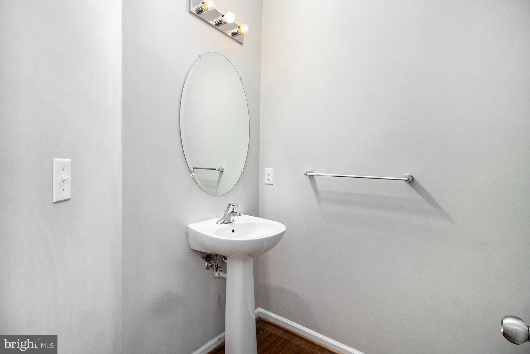 1226 Cabin Road Hatfield, PA 19440 - Photo 13 of 28 a bathroom with a sink and mirror