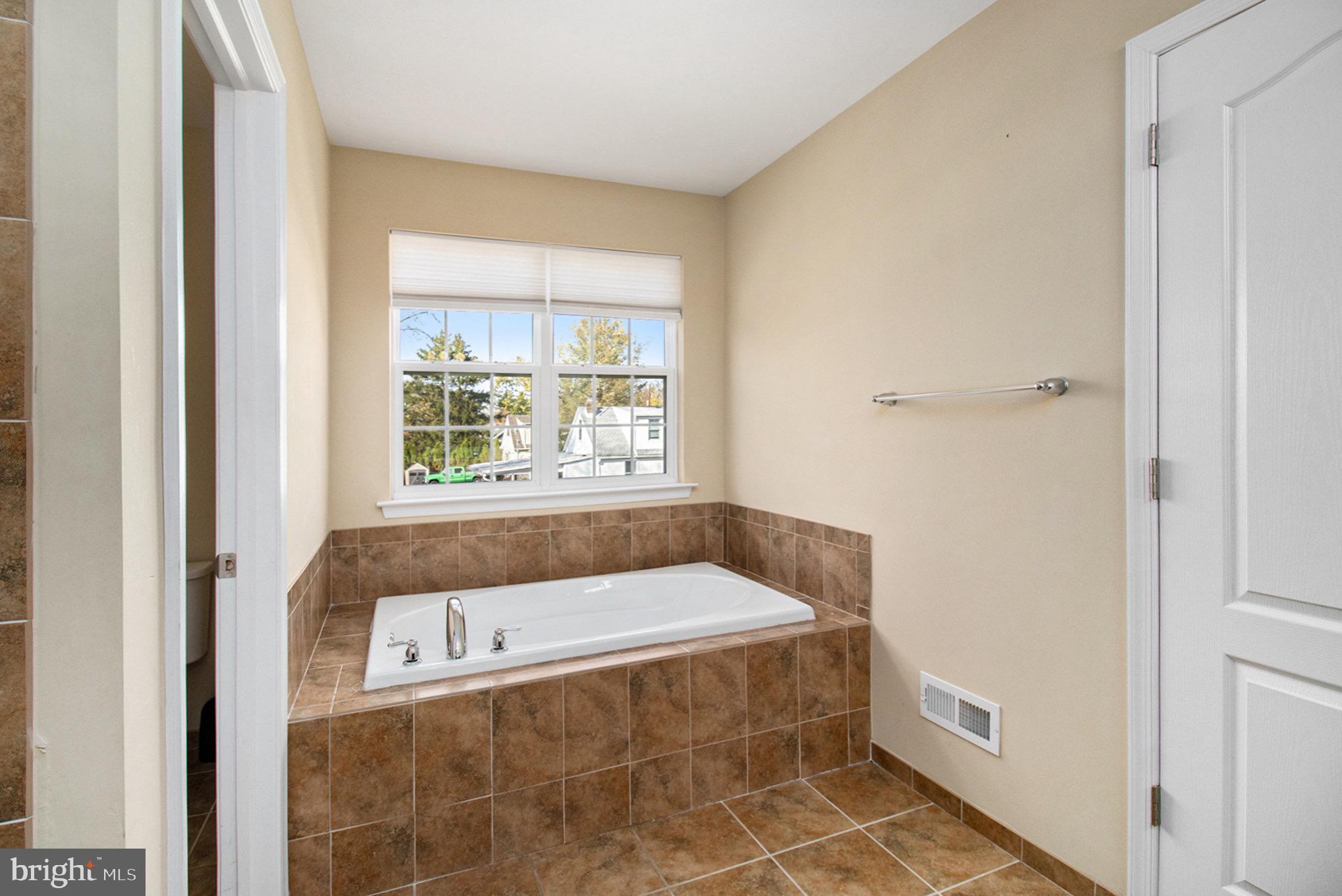 1226 Cabin Road Hatfield, PA 19440 - Photo 18 of 28 a bathroom with a tub and window