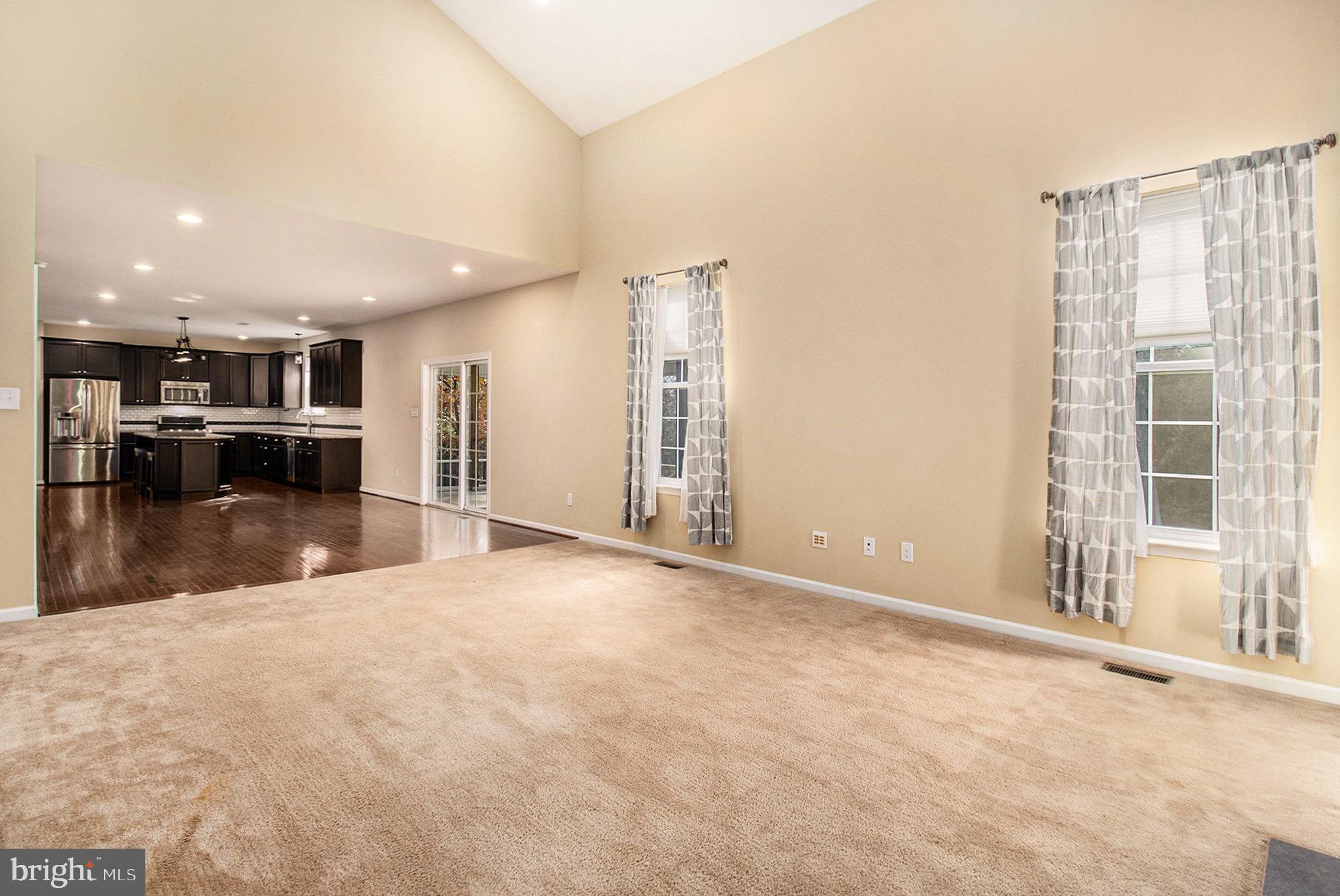 1226 Cabin Road Hatfield, PA 19440 - Photo 10 of 28 a view of an empty room with kitchen and a window