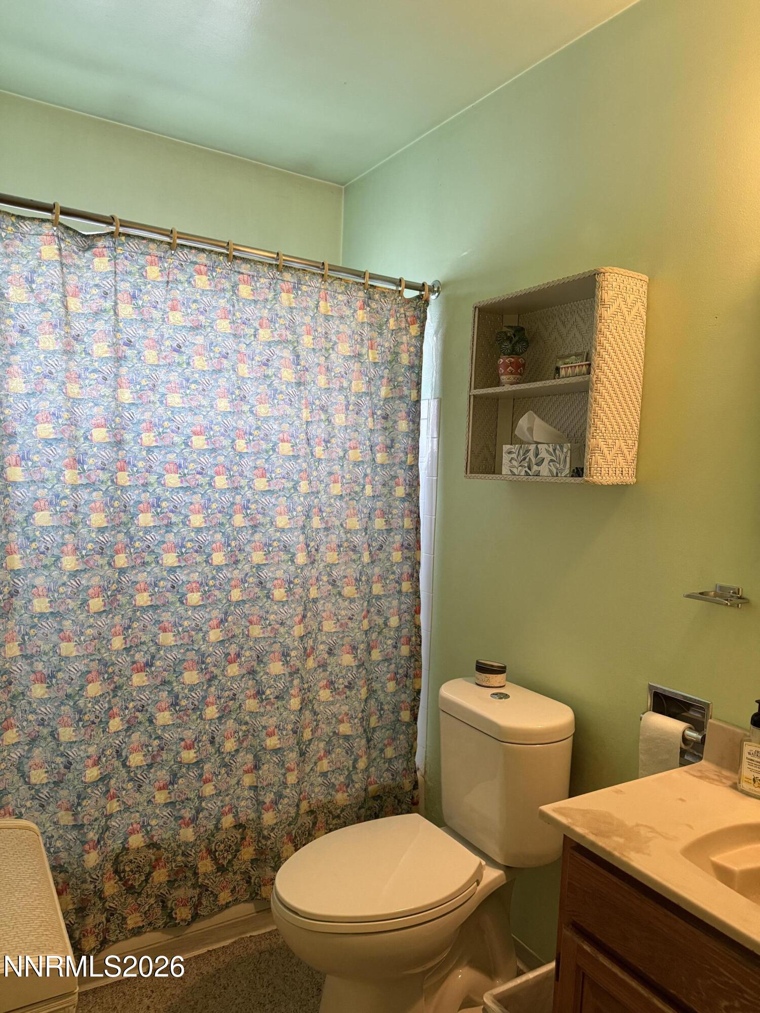 870 Capitol Hill Avenue Reno, NV 89502 - Photo 15 of 24 a bathroom with a toilet and a shower curtain