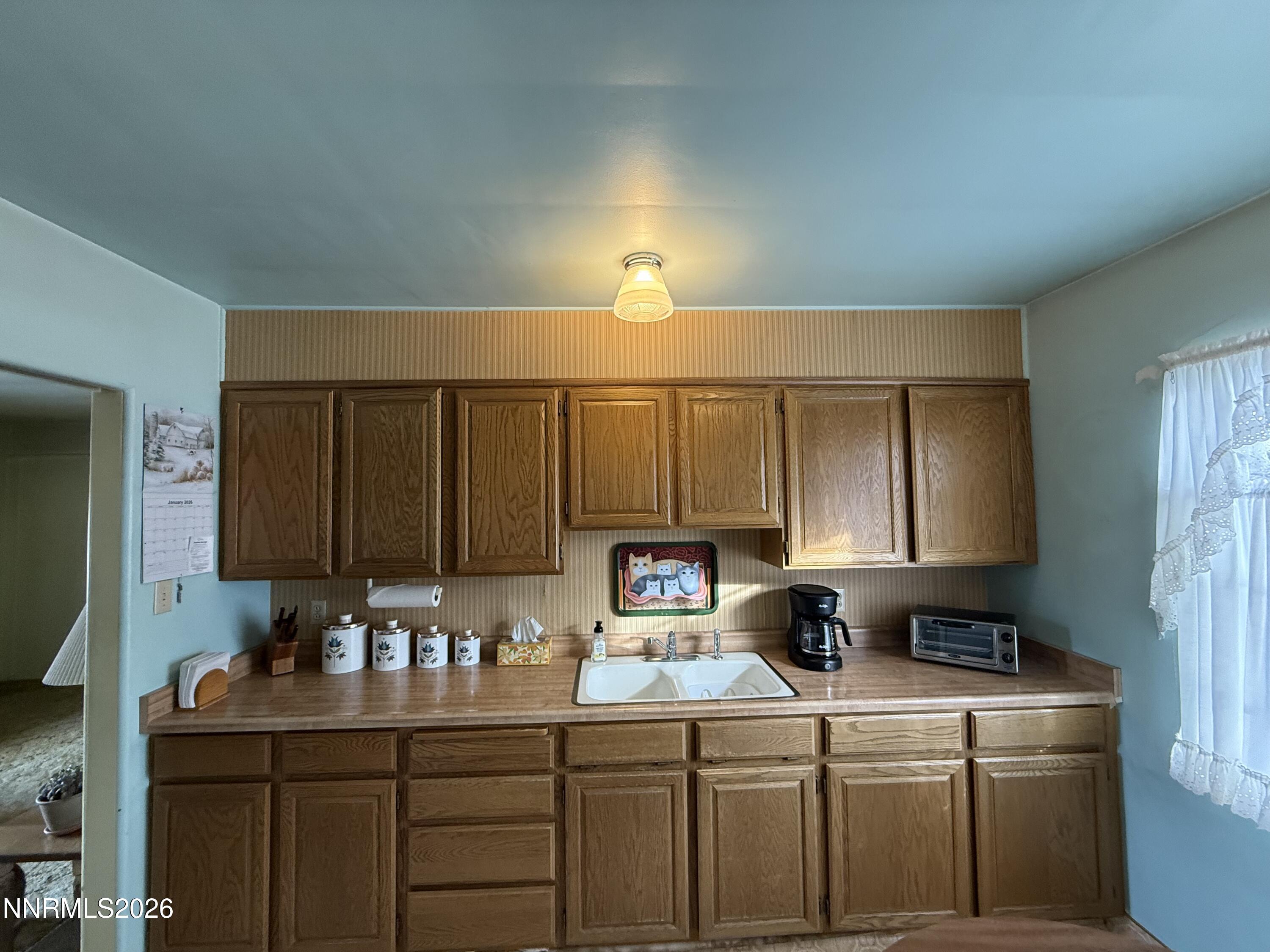 870 Capitol Hill Avenue Reno, NV 89502 - Photo 4 of 24 a kitchen with a sink cabinets and window