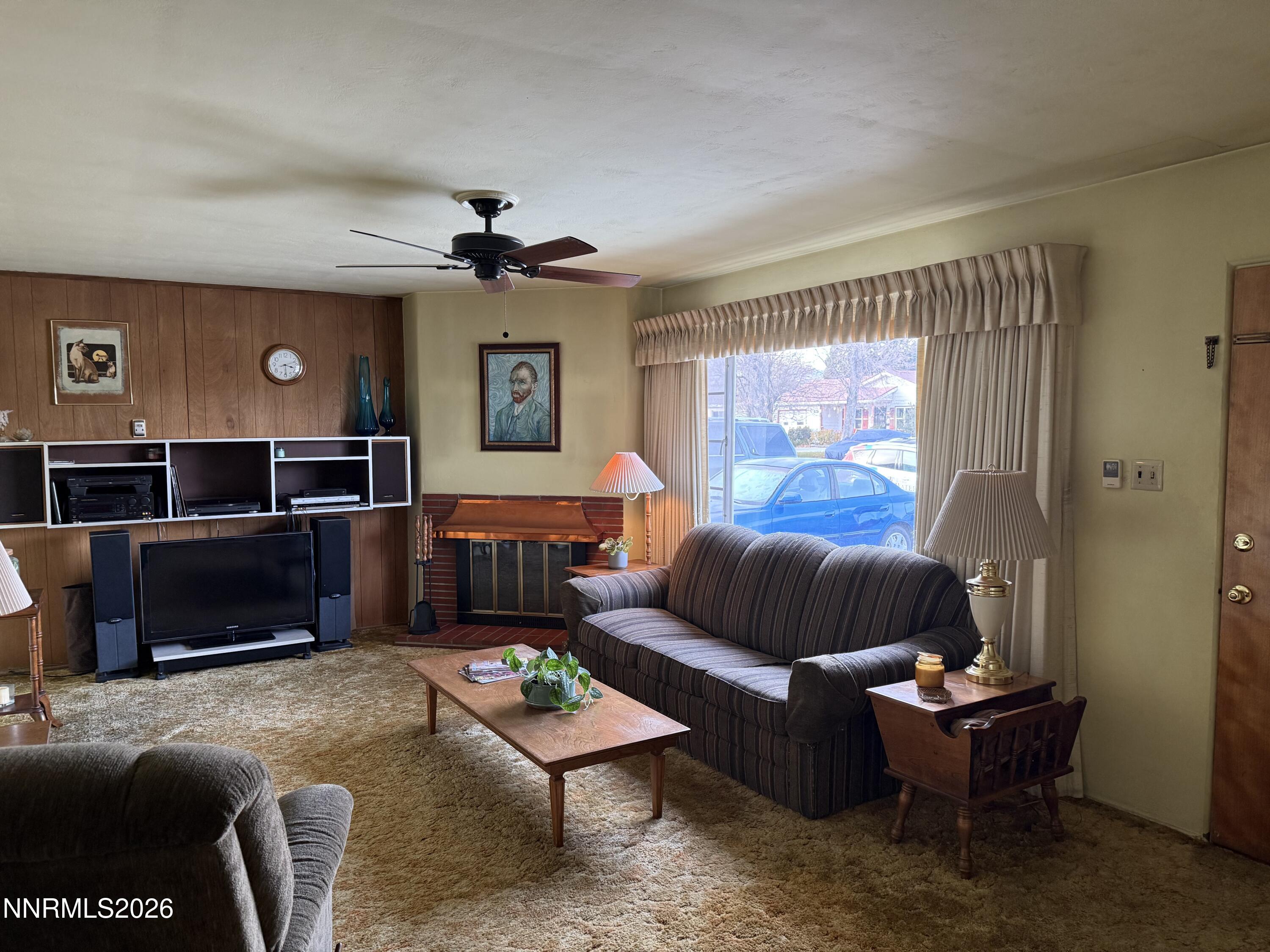 870 Capitol Hill Avenue Reno, NV 89502 - Photo 5 of 24 a living room with furniture and a flat screen tv