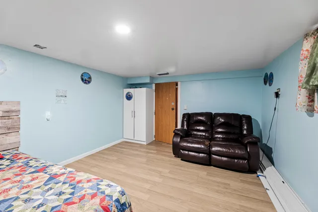 a bedroom with a bed and a couch