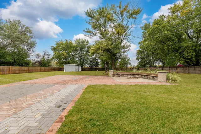 a view of a swimming pool with a yard