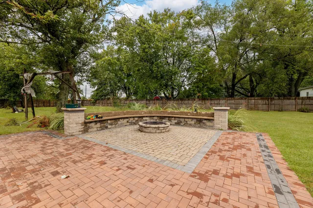 a view of a swimming pool with a patio