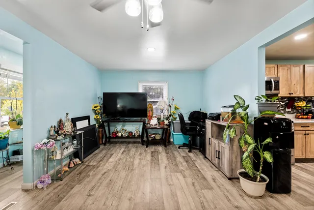 a living room with furniture and a flat screen tv