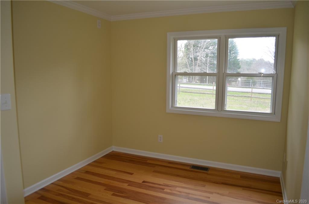 1773 Shearers Road Davidson, NC 28036 - Photo 13 of 19 a view of a room with wooden floor and a window