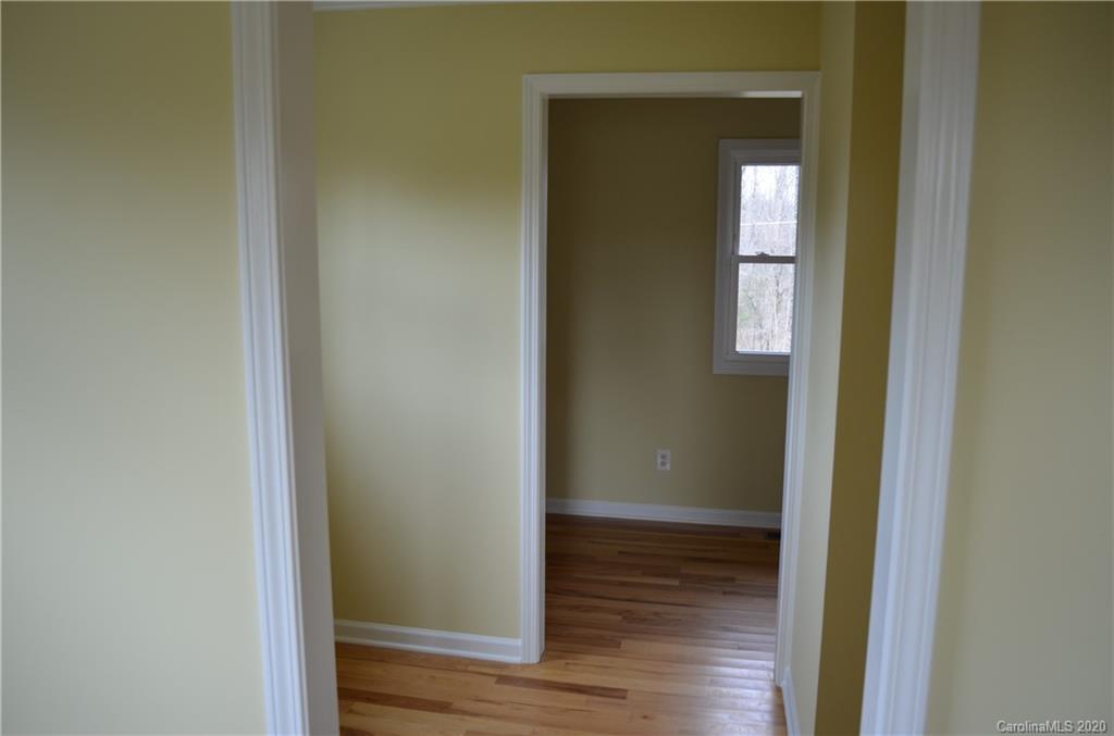 1773 Shearers Road Davidson, NC 28036 - Photo 16 of 19 a view of front door with wooden floor