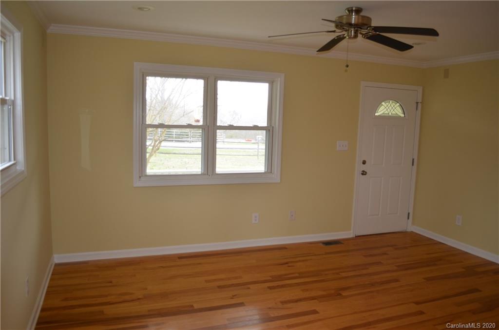 1773 Shearers Road Davidson, NC 28036 - Photo 6 of 19 a view of a room with wooden floor and fan