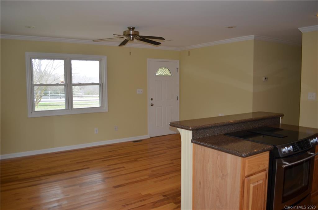 1773 Shearers Road Davidson, NC 28036 - Photo 9 of 19 a view of a room that has wooden floor and a window