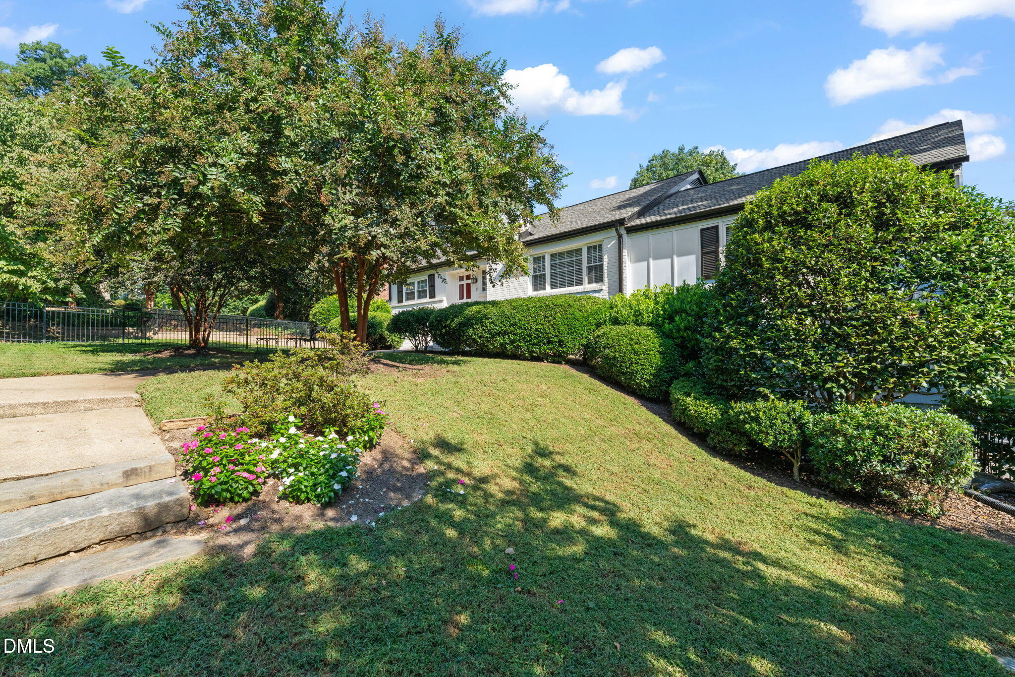 406 Chesterfield Road Raleigh, NC 27608 - Photo 13 of 25 a view of a house with a yard