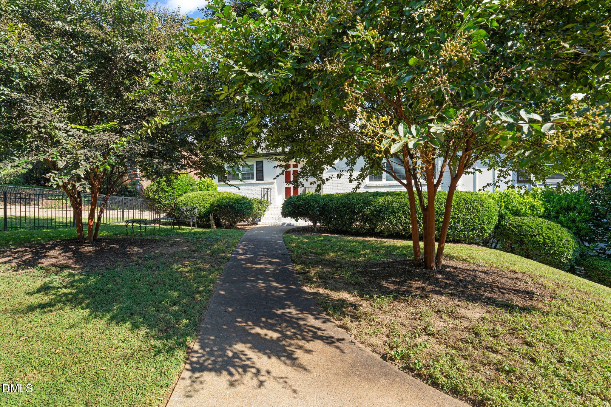 406 Chesterfield Road Raleigh, NC 27608 - Photo 14 of 25 a view of a yard with plants and trees