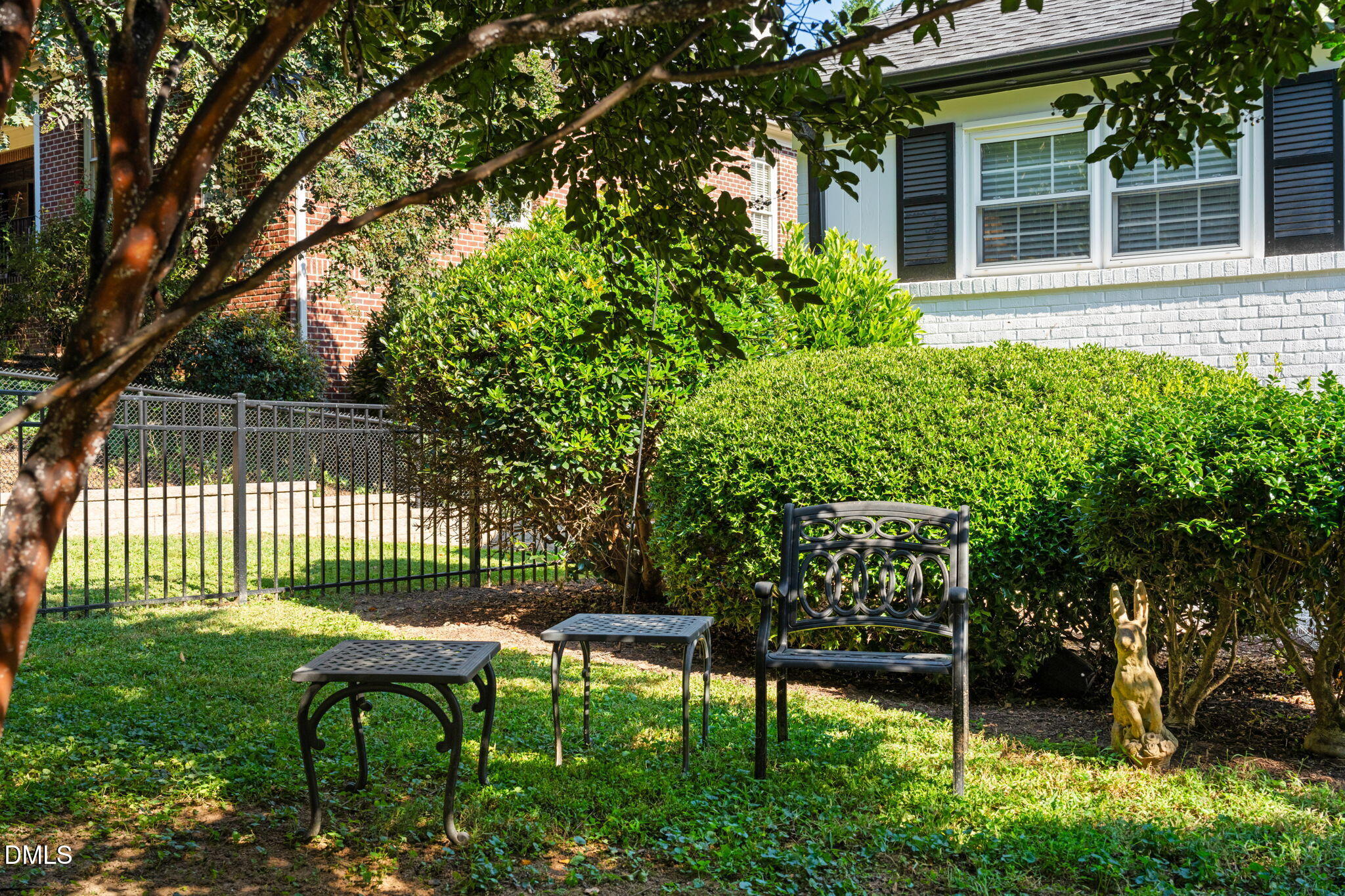 406 Chesterfield Road Raleigh, NC 27608 - Photo 20 of 25 a view of a chair and table in backyard of the house