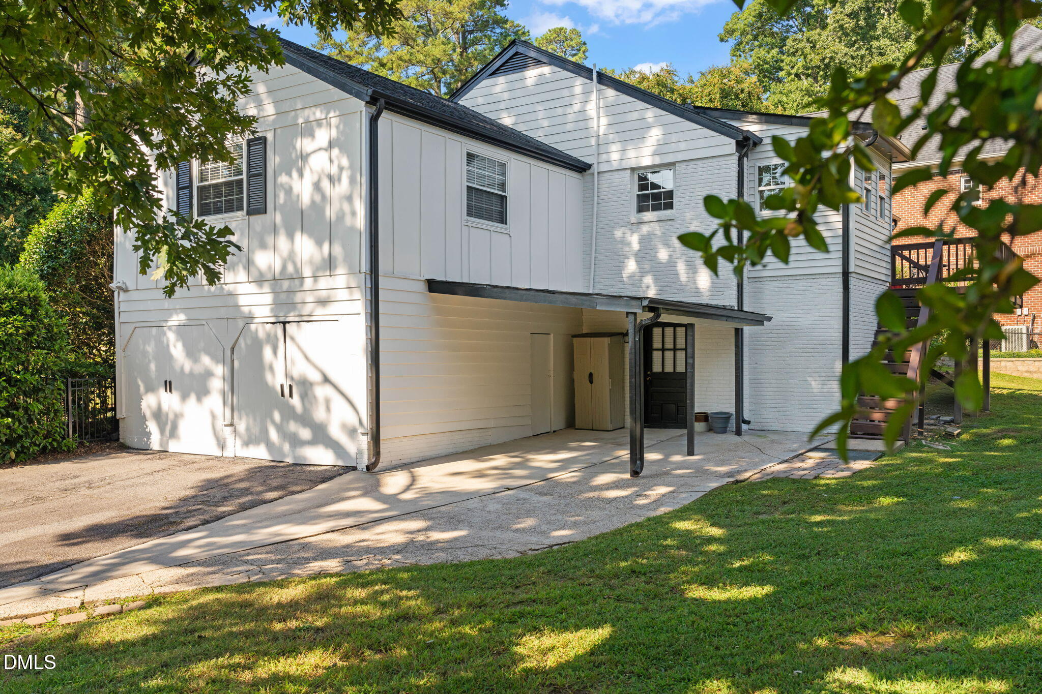 406 Chesterfield Road Raleigh, NC 27608 - Photo 3 of 25 a view of house with backyard and a tree