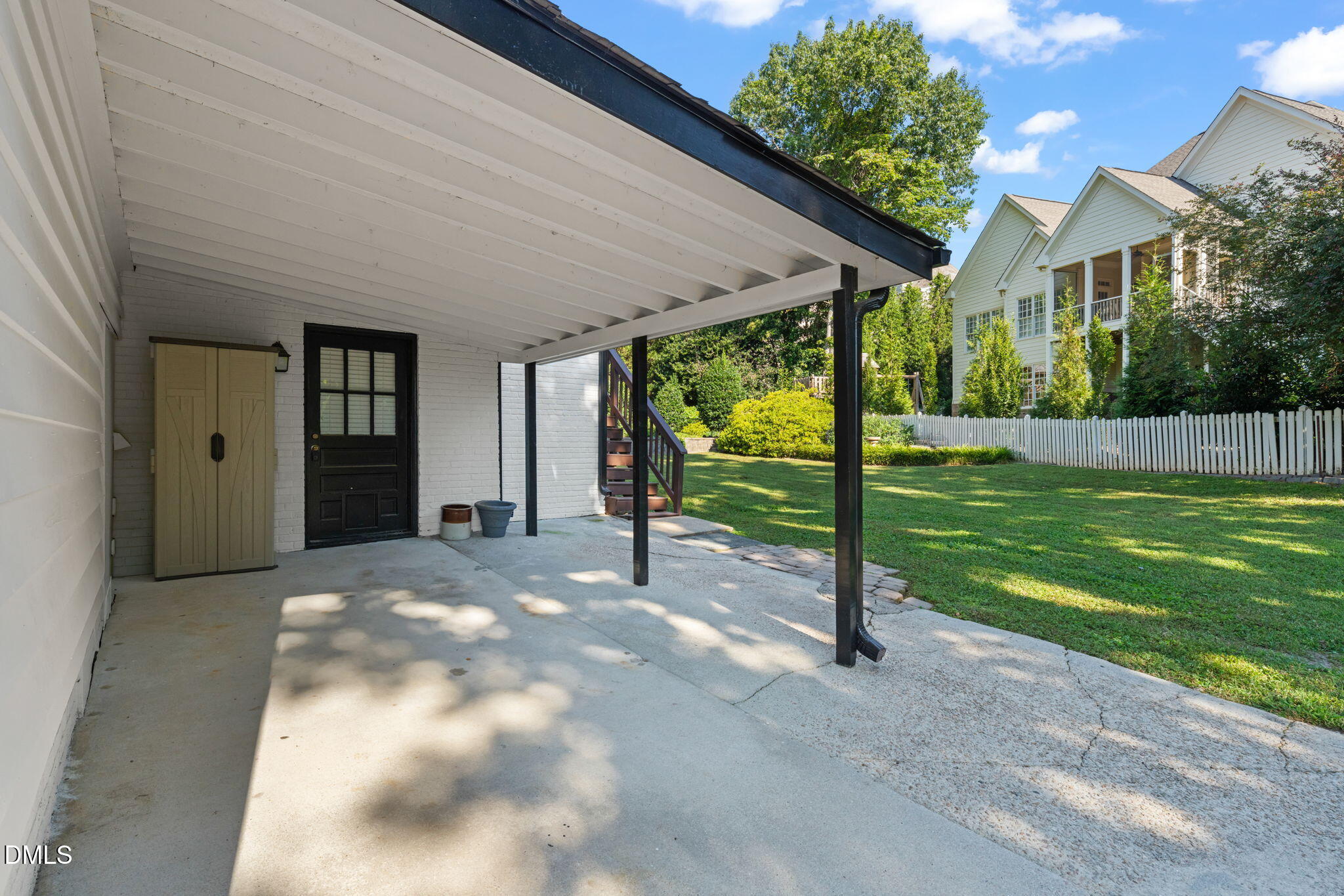 406 Chesterfield Road Raleigh, NC 27608 - Photo 4 of 25 a view of a house with backyard and a tree