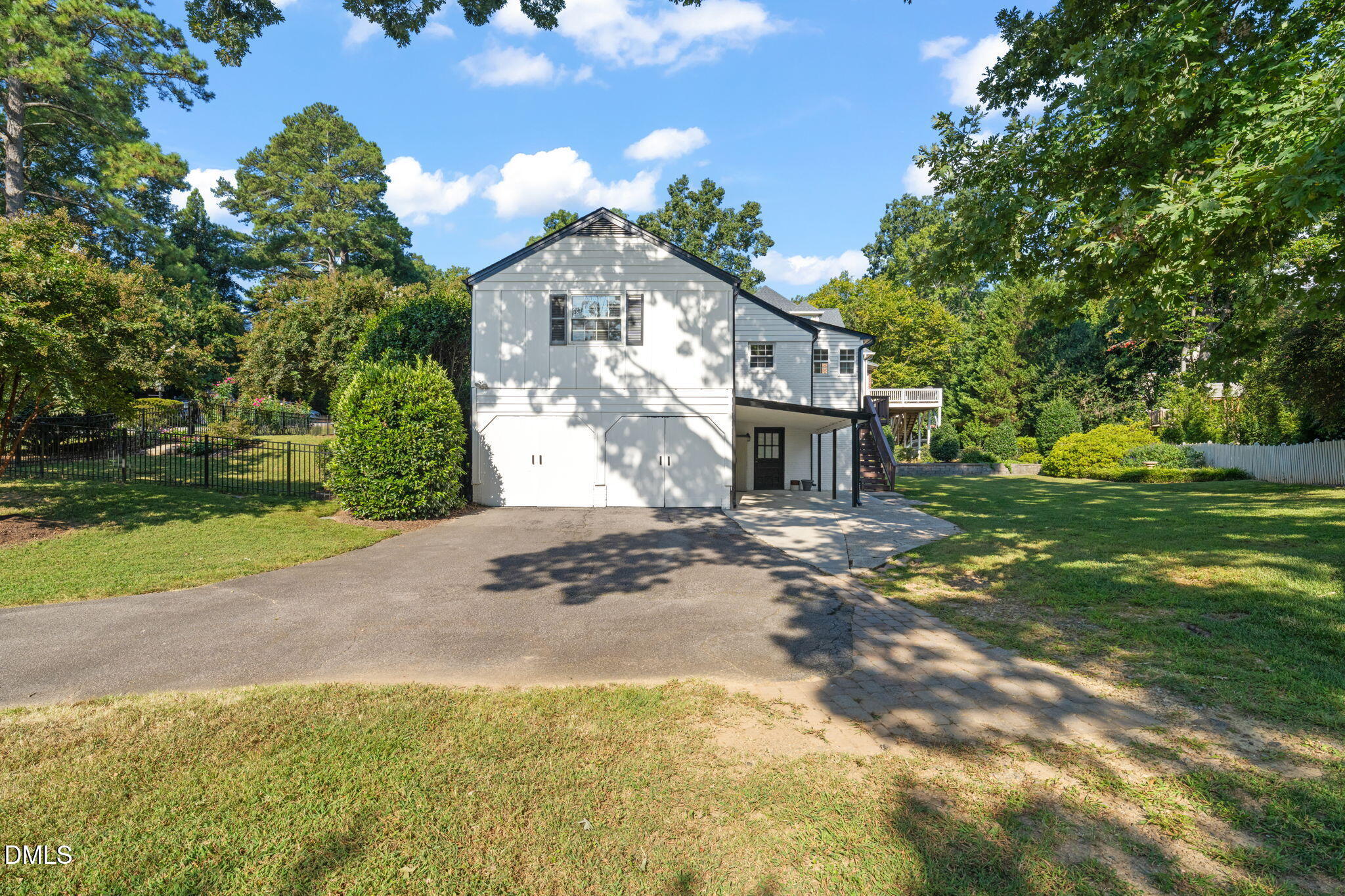 406 Chesterfield Road Raleigh, NC 27608 - Photo 5 of 25 a front view of a house with a yard and garage