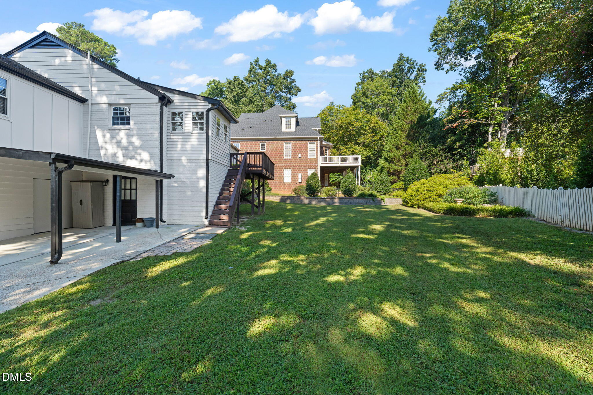406 Chesterfield Road Raleigh, NC 27608 - Photo 6 of 25 a view of a house with a backyard