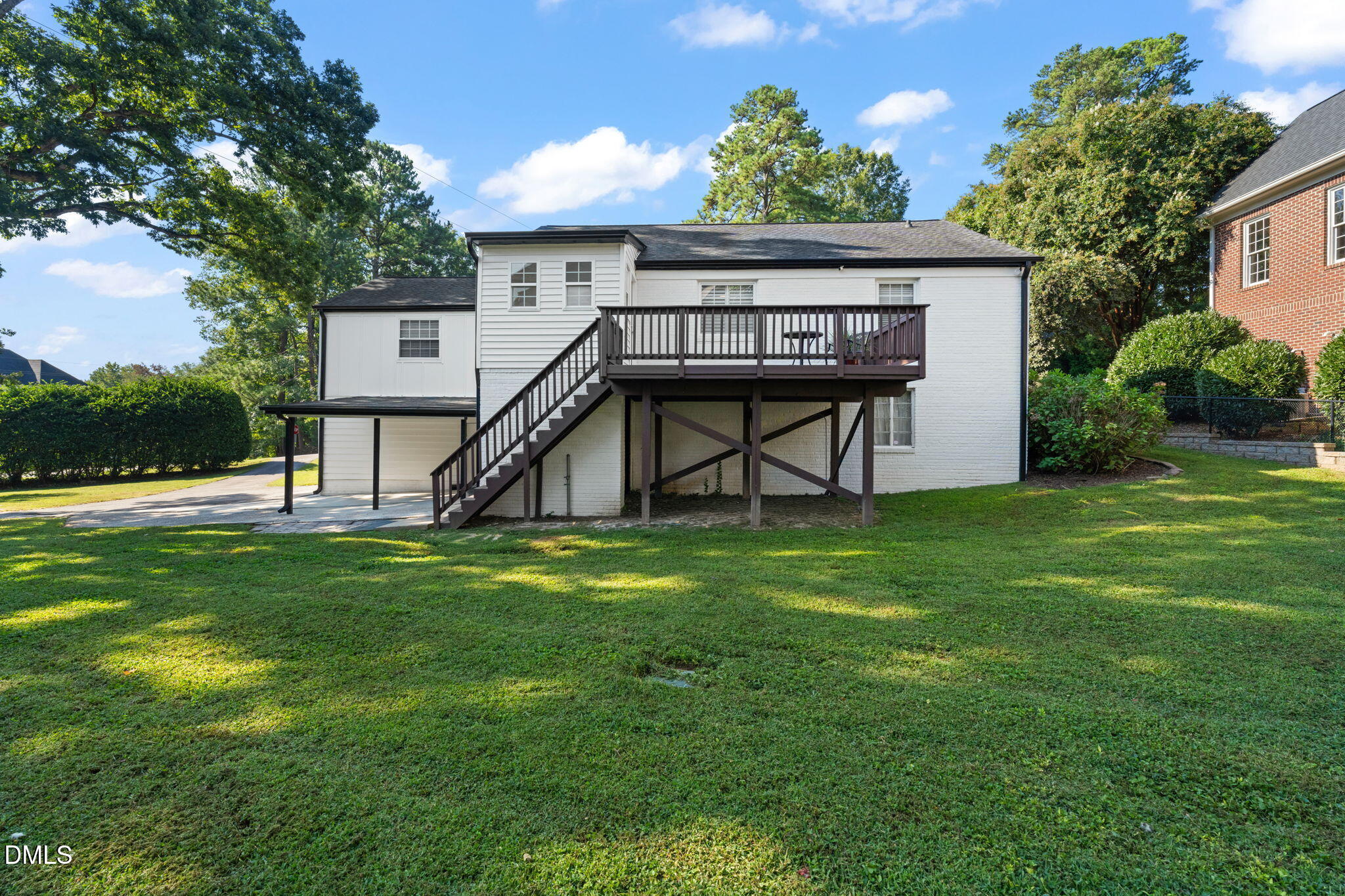 406 Chesterfield Road Raleigh, NC 27608 - Photo 8 of 25 a view of a house with a back yard