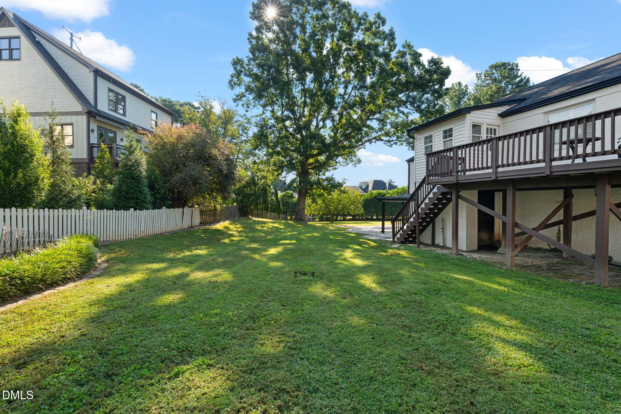406 Chesterfield Road Raleigh, NC 27608 - Photo 9 of 25 a view of a house with a yard and deck