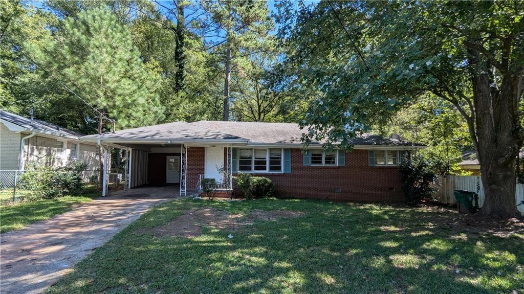 1164 Longshore Drive Decatur, GA 30032 - Photo 1 of 1 a front view of a house with garden