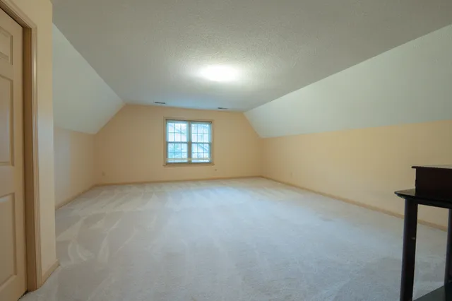 a view of a hallway with stairs