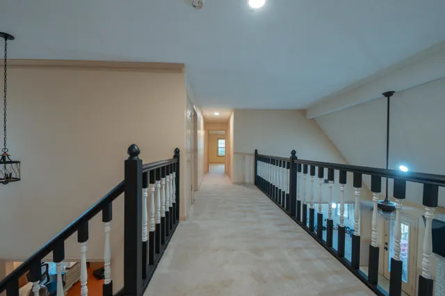 a view of a porch with furniture and a yard