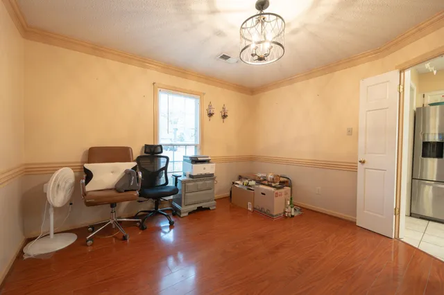 a room with furniture and wooden floor